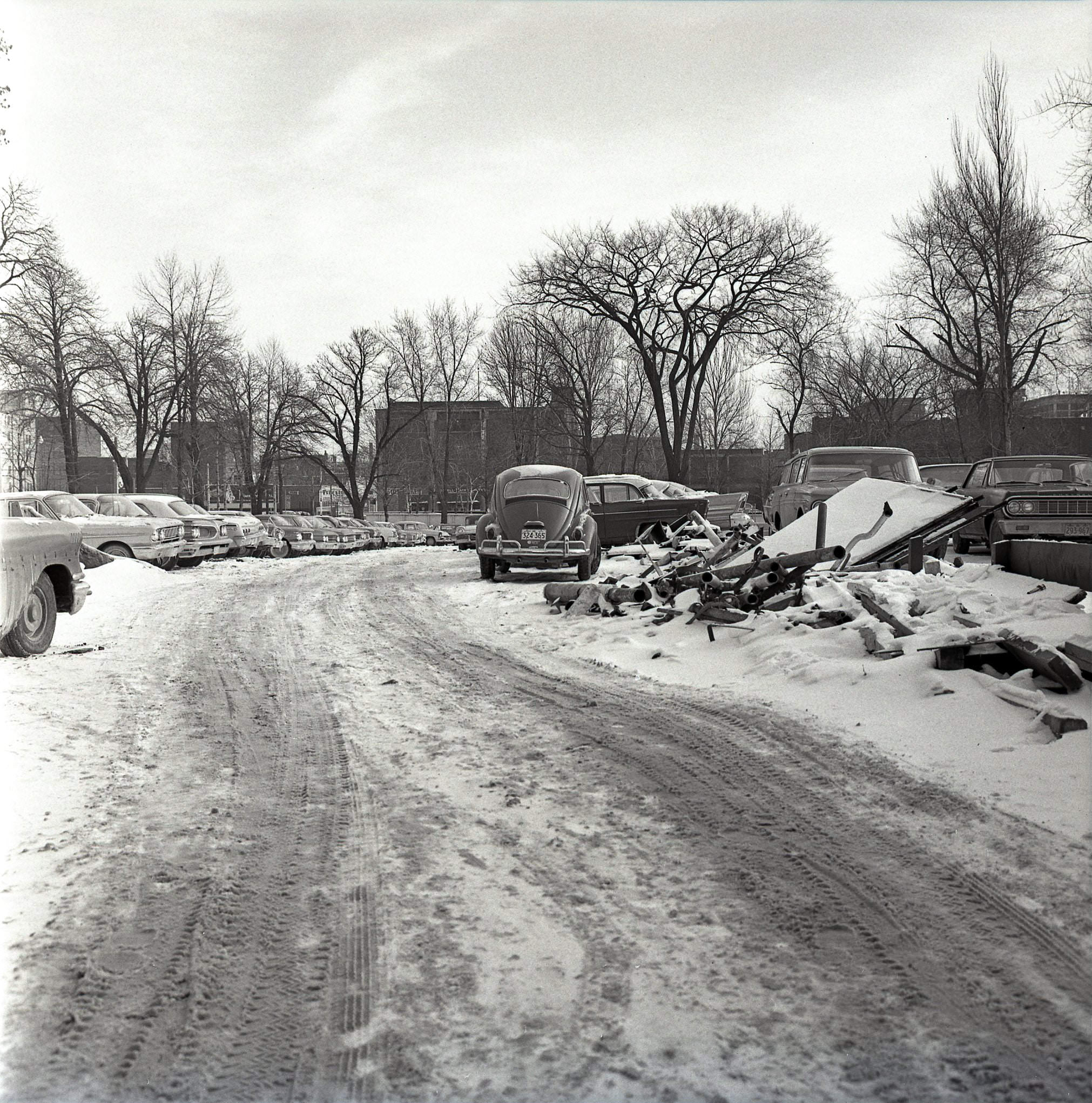 The future Macdonald Block / 900 Bay Street site, looking east toward Bay. The building with the Studebaker sign in the distance is at 945 Bay, 1970s