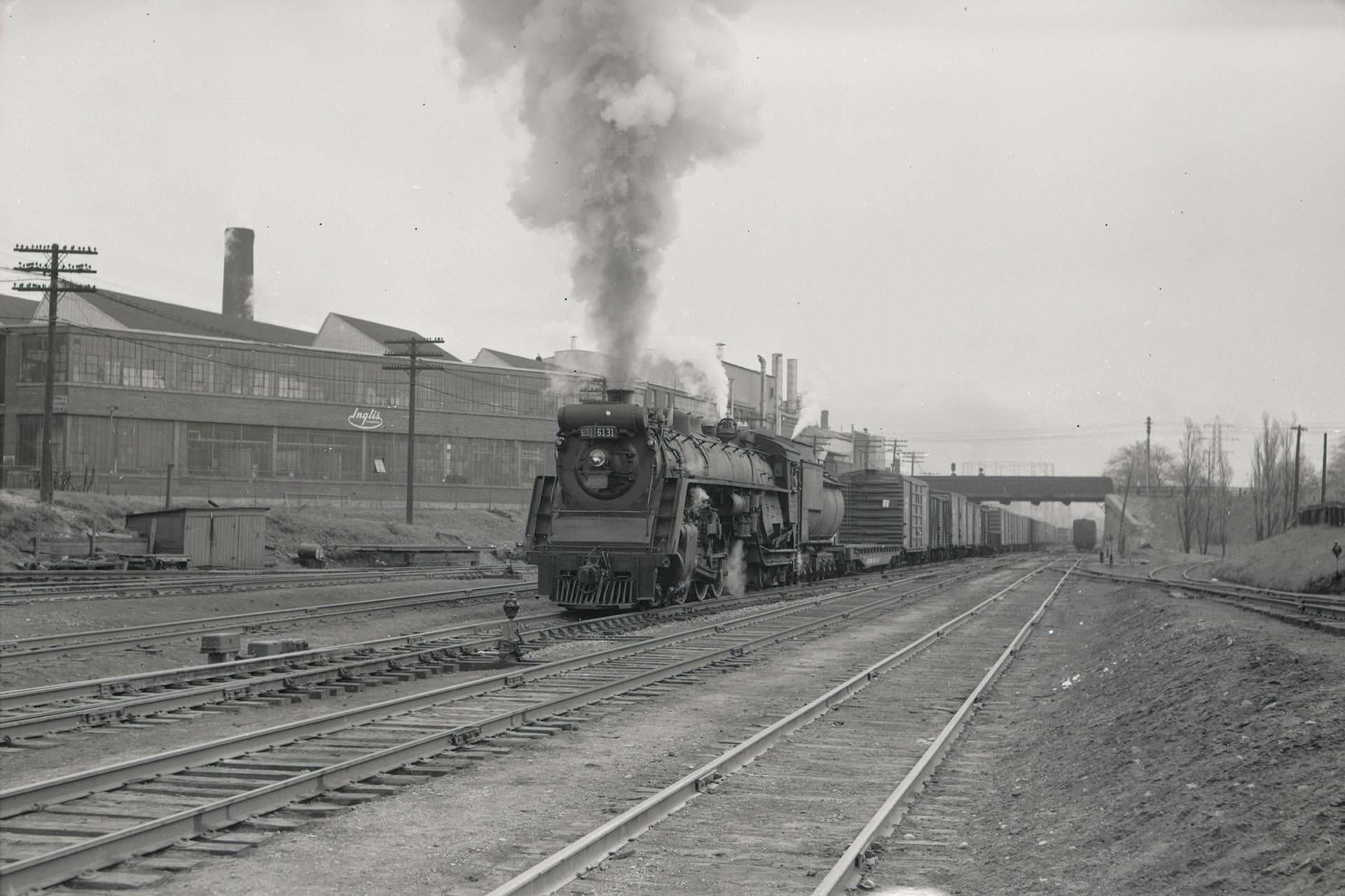 C.N.R. No. 6131, looking east towards John Inglis factory and Strachan Avenue bridge, May 2, 1955.