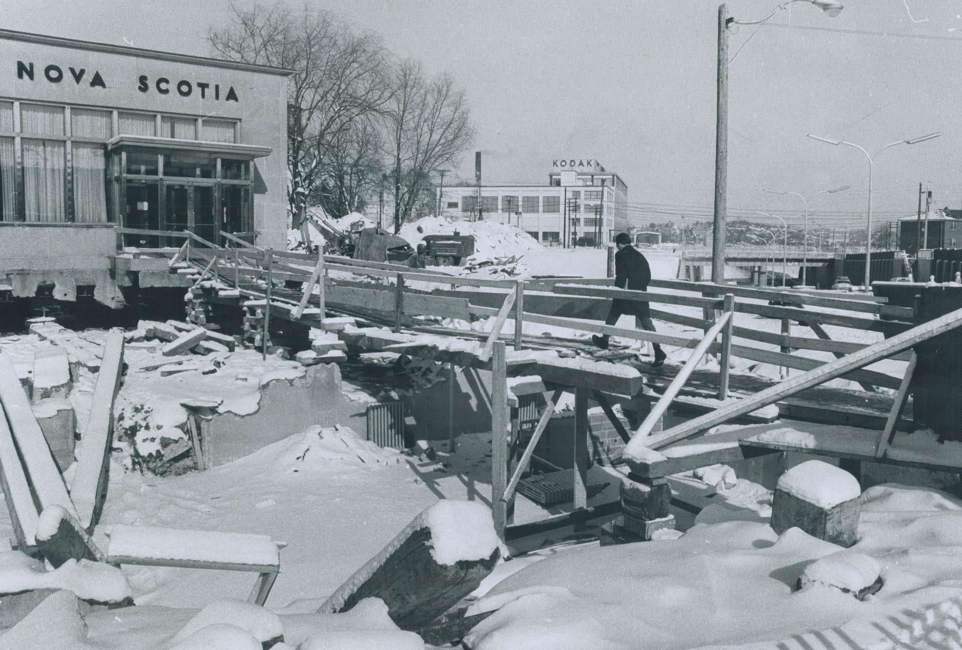 The Bank of Nova Scotia branch at Eglinton Ave. W. and Weston Rd. creeps back a few feet a day to make way for widening of Eglinton, 19677