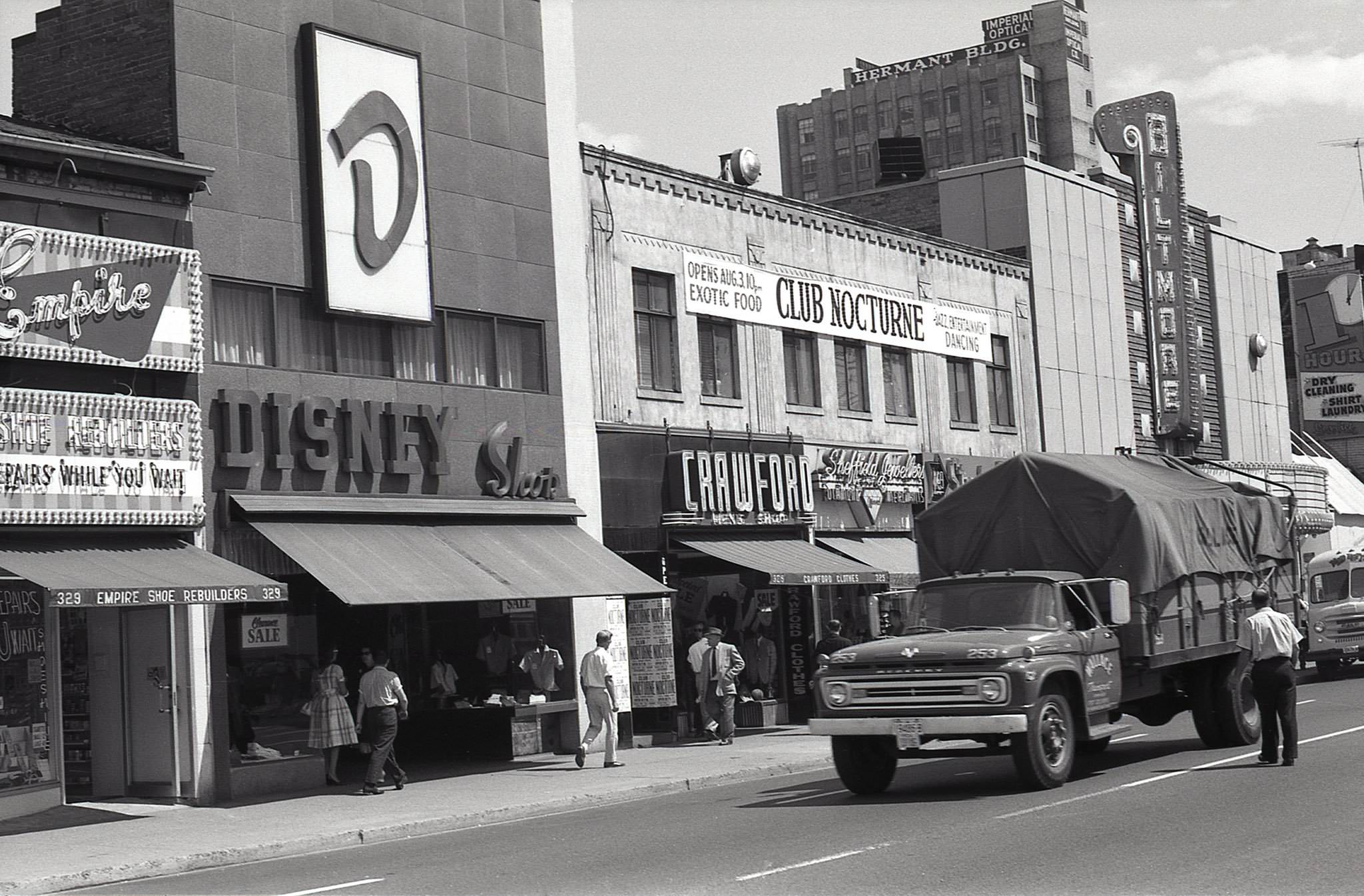 A look back south towards the Biltmore Theatre, at 319 Yonge Street, 1962. Upstairs, at 321-325 Yonge, a sign indicating the opening of ‘Club Nocturne’