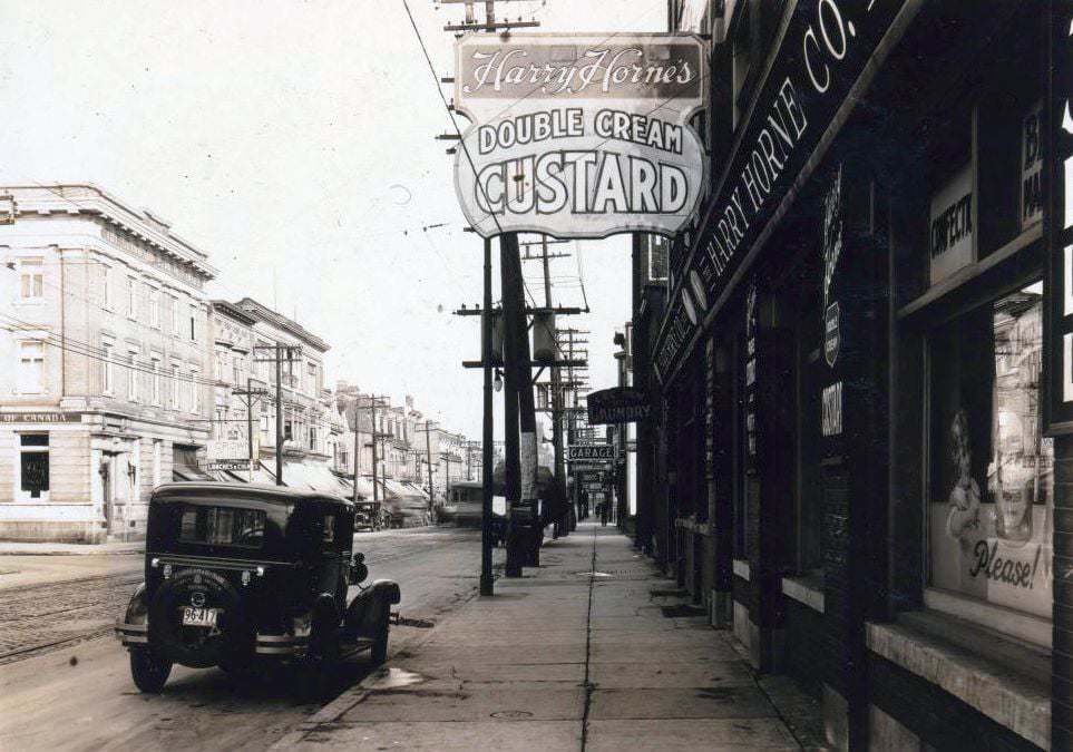 Harry Horne's Double Cream Custard - Queen Street West, at Cowan Avenue. View is looking east on Queen Street West, 1928