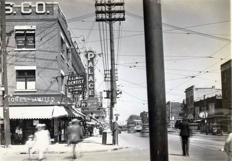 Palace Theatre, 664 Danforth Avenue, near Pape Avenue, showing its overhanging electric sign. View is looking east on Danforth Avenue, from Pape Avenue, 1920s