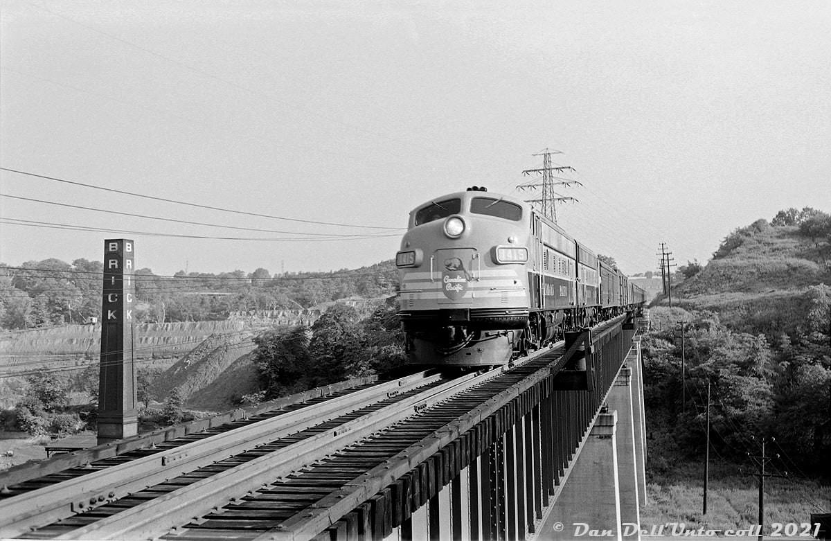 A Canadian Pacific passenger train lead by nearly new FP9 1415 heads southbound down the Don Branch bound for Toronto's Union Station, 1954