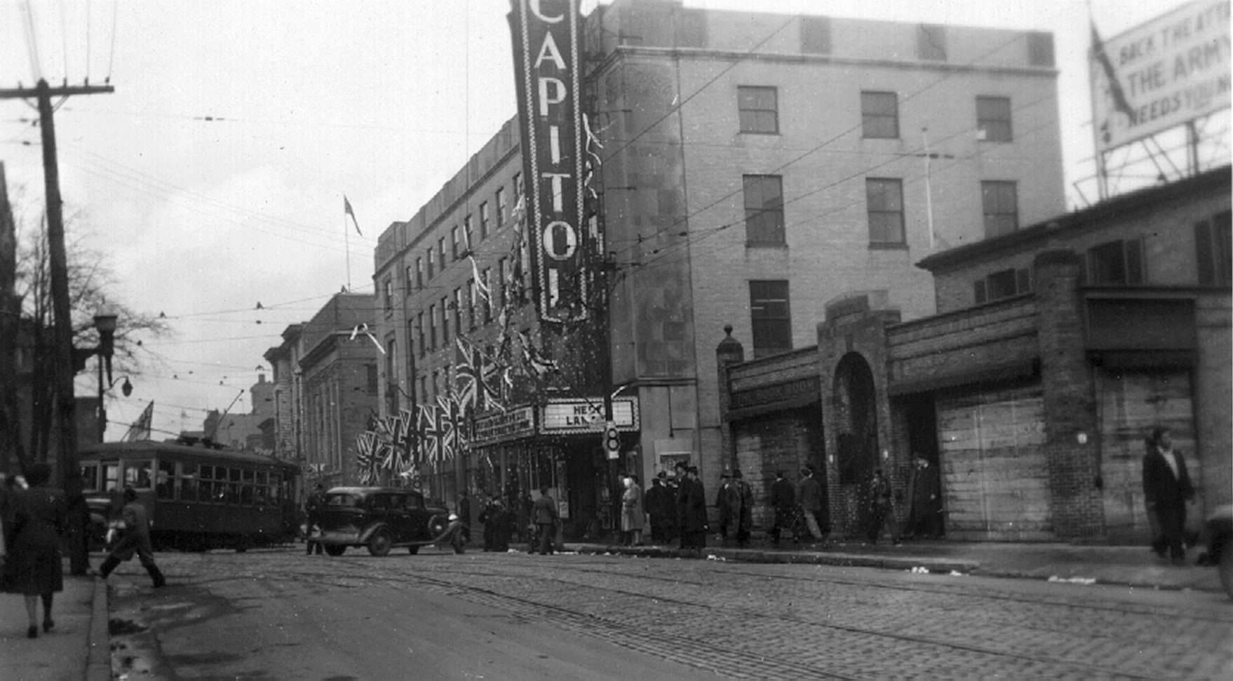 Toronto Street scene, 1940s. The building on the near side of the theatre has "The Book Room" cast right into the facade.