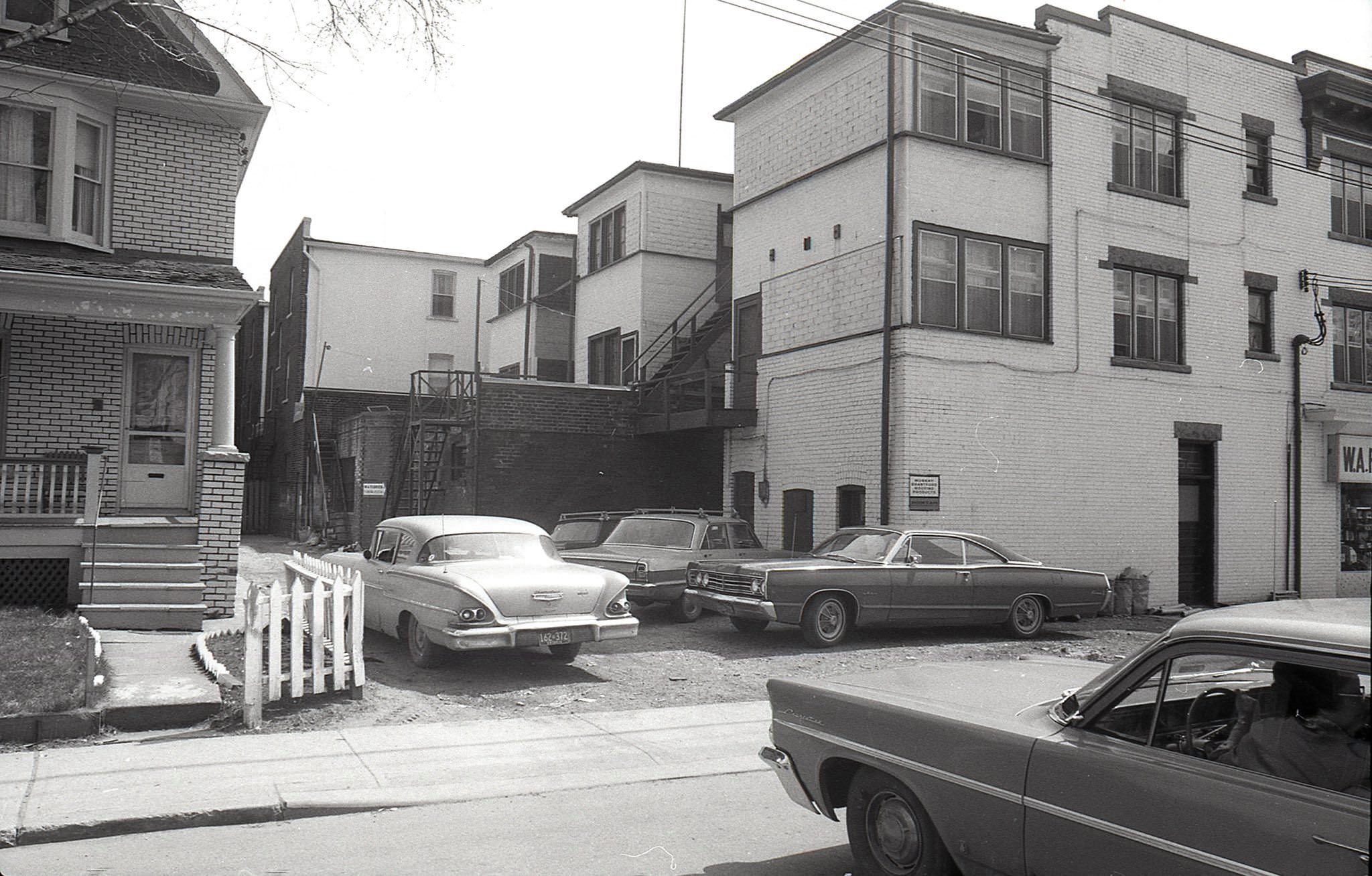 The laneway and parking behind Ferriers block, 526 - 536 Danforth Ave., 1969. Looking east from Ferrier Avenue.