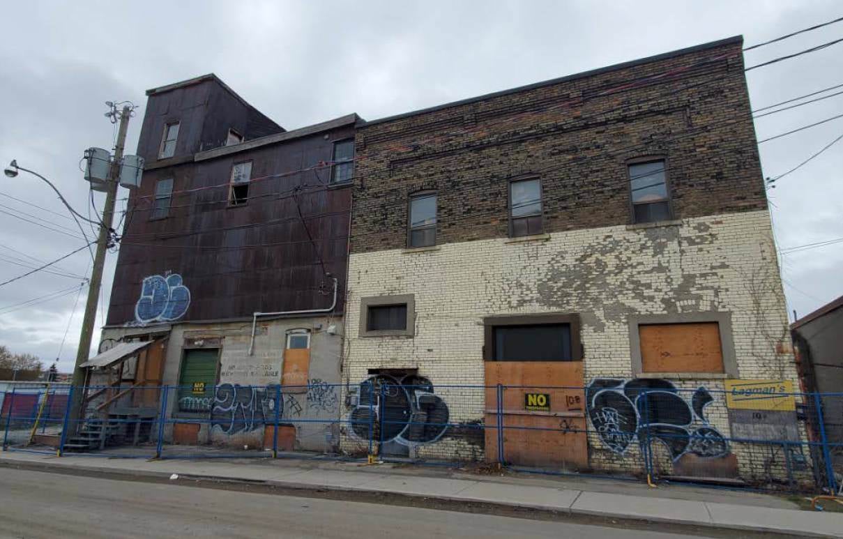 10 Dawes Road, constructed in the 1890s as a flour mill and grain elevator. Now a heritage building as a rare surviving mill building in Toronto, 1980s