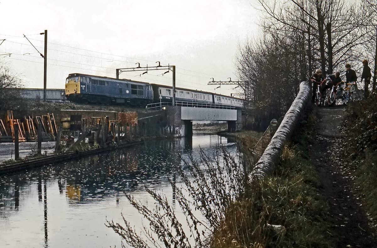 Brush Type 2 No. 31401 crosses the Wyrley & Essington canal at Heath Town with up empty coaching stock on 20th November 1983.