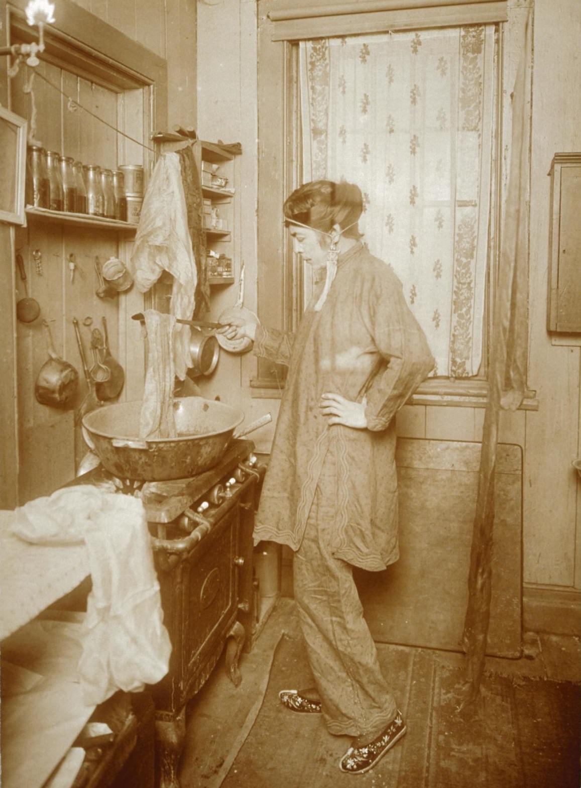 Allison at her kitchen stove, dying scarves, 1920