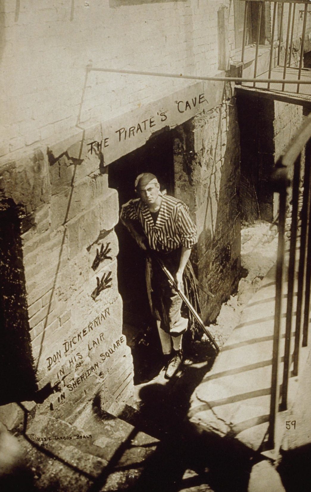 Portrait of Don Dickerman standing in the doorway of his business, 1920