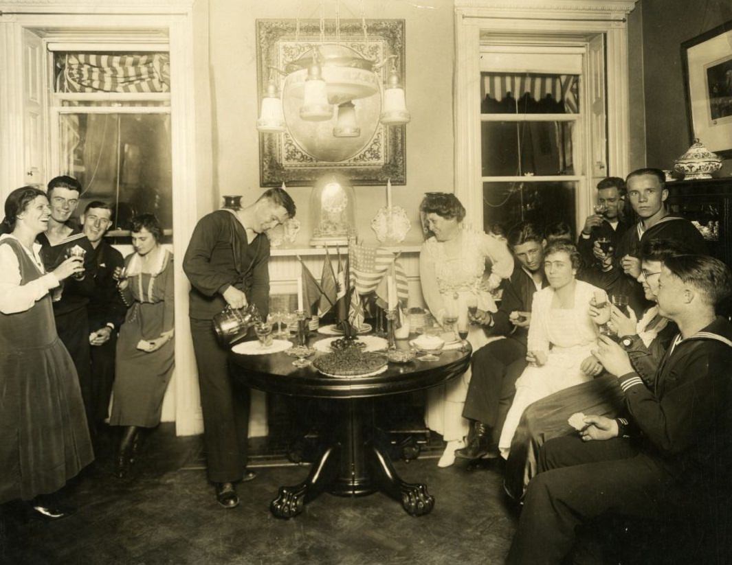 Alice Foote MacDougal entertaining a group of sailors in her small apt in Old War