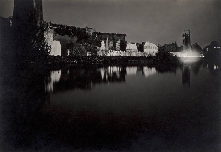 View of the stage of the Pageant and Masque of St. Louis looking across the lagoon lit for evening performance of the Pageant of St. Louis.