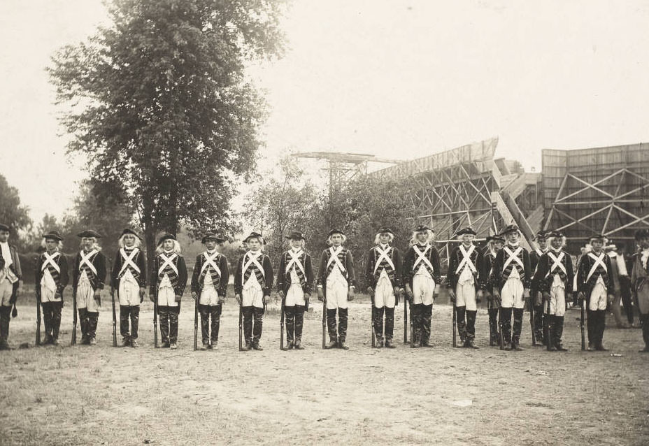 Actors in costume as French troops in the Pageant, Pageant and Masque of St. Louis, pose off stage, 1914