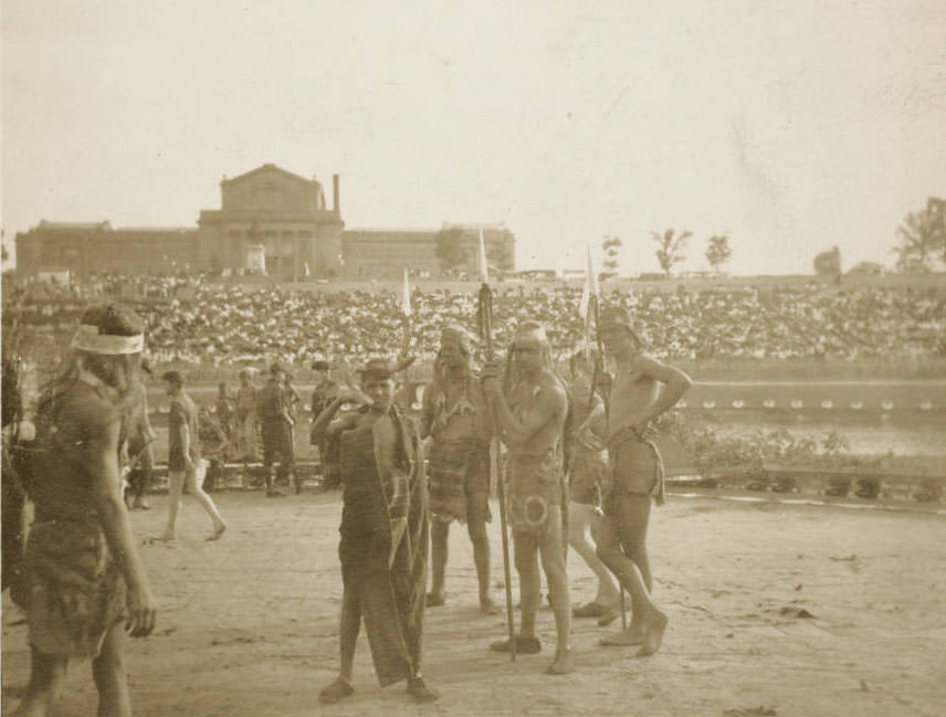 A group of volunteer actors in dress of American Indians stand on the stage of the Pageant, Pageant and Masque of St. Louis, 1914