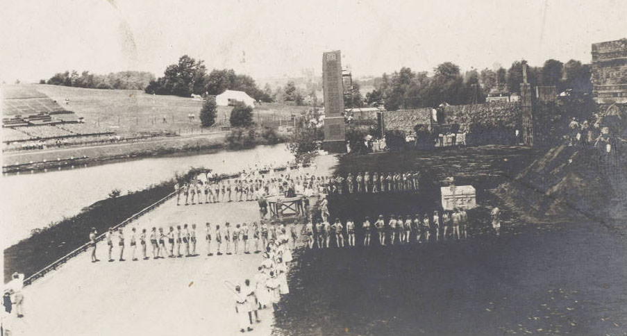 Men, women, boys and girls costumed as Maya Indians line up on the set, a plaza before the ancient temple of Maya civilization, in a scene from the Masque, Pageant and Masque of St. Louis, 1914