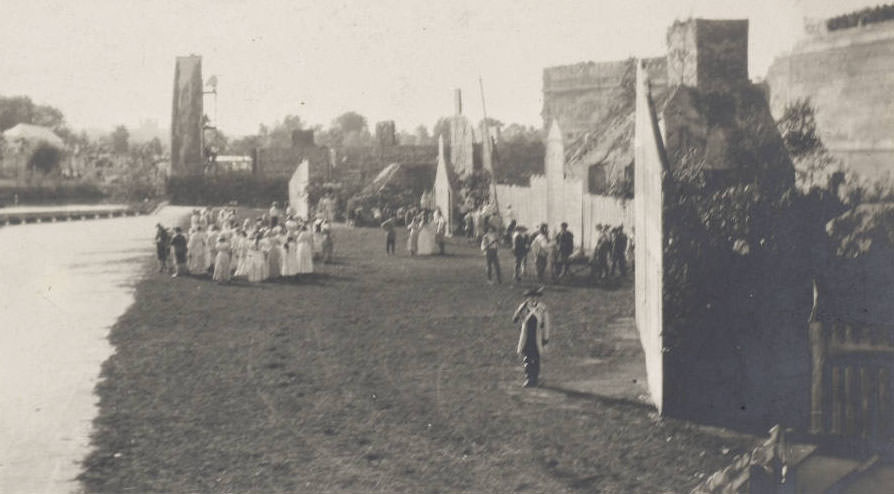 In a side view of the stage of the Pageant and Masque of St. Louis, actors perform a scene in the Pageant of St. Louis, 1914