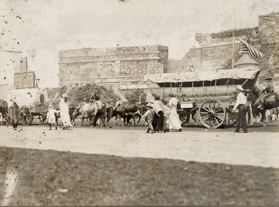 In a scene in the Pageant, Pageant and Masque of St. Louis, an ox-drawn wagon train with American settlers arrives in St. Louis in the early 19th century.