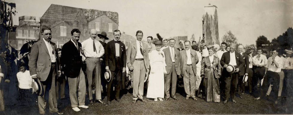 Members of the executive committee of the Pageant and Masque stand on the dramas' set. Several prominent citizens served on the committee for the civic drama held in Forest Park, May 1914.