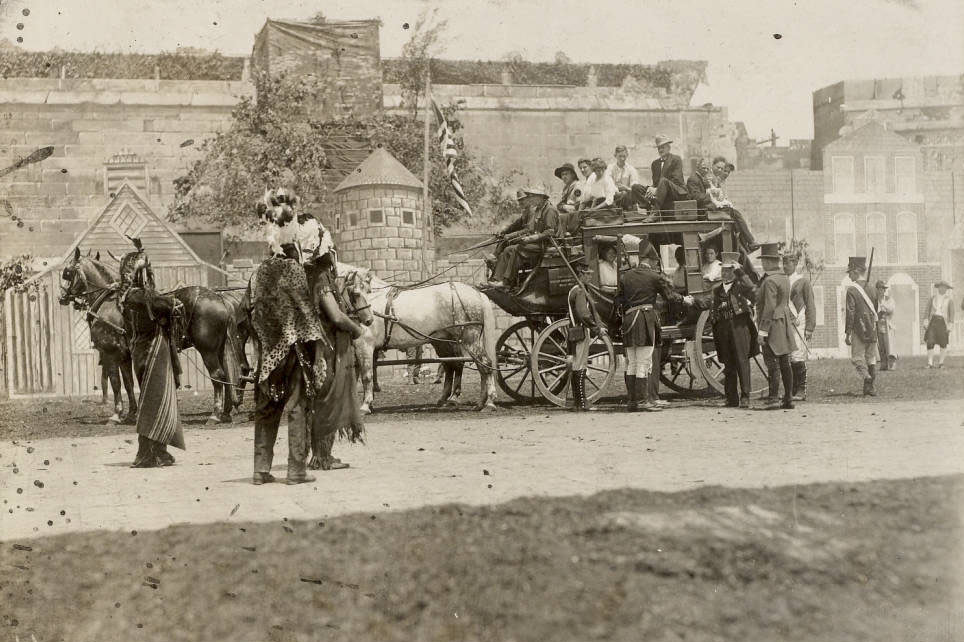 On stage in the Pageant, Pageant and Masque of St. Louis, General William Henry Harrison leaves St. Louis after his negotiations with the Sauk and Fox Indians, who stand and watch the scene.