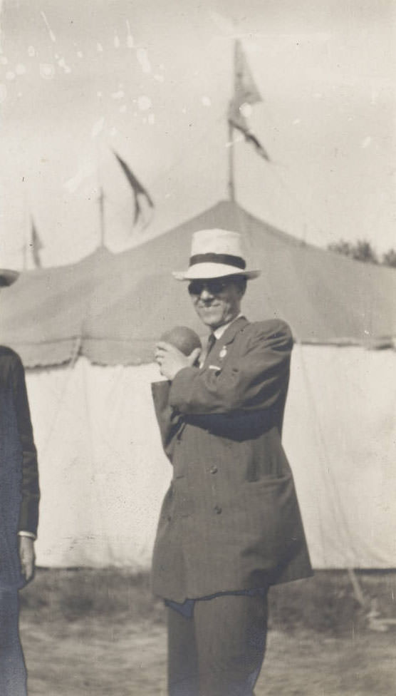 Man with white hat holding ball, 1914