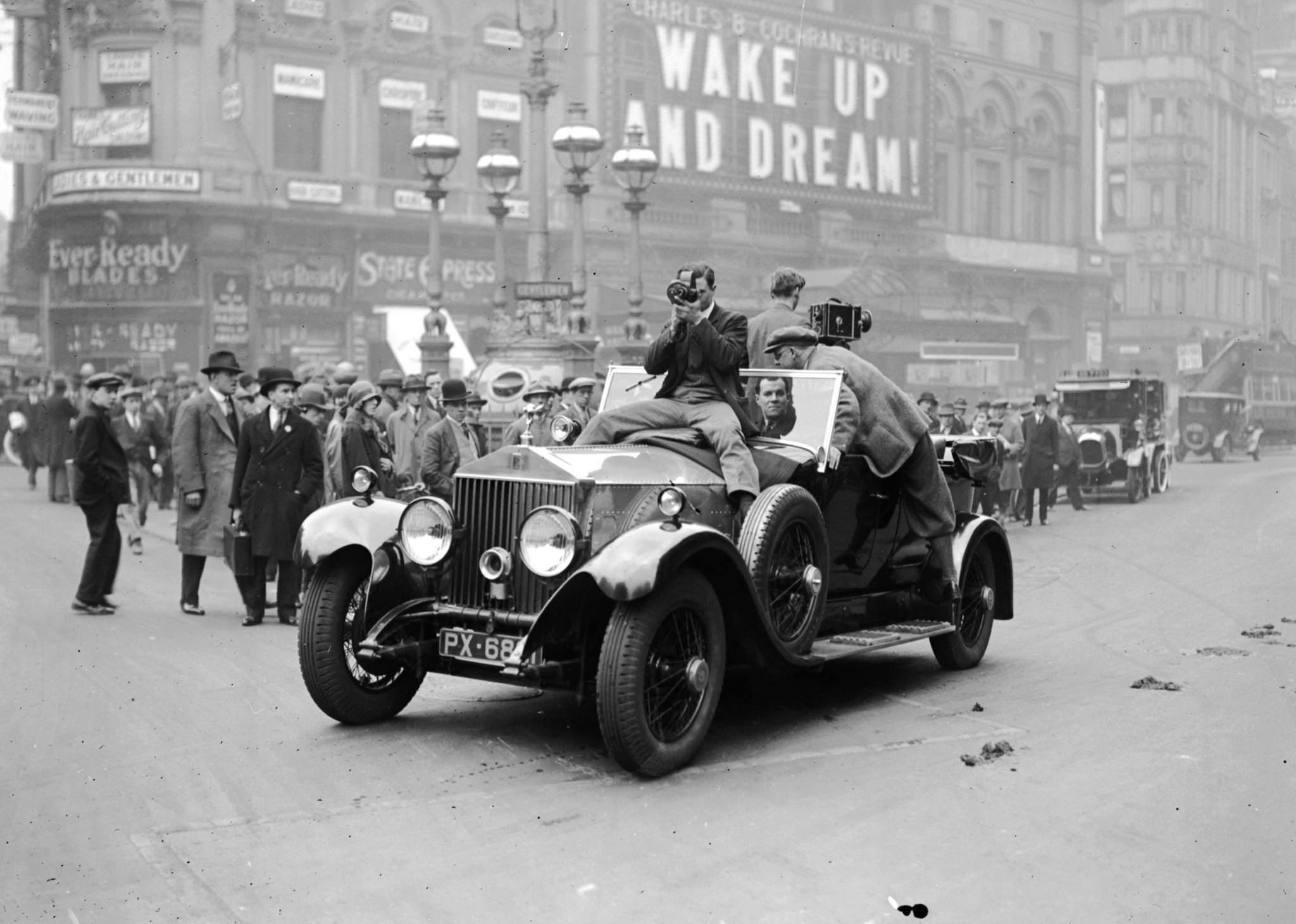 Cameramen filming from a Rolls Royce in Piccadilly, London, 1929