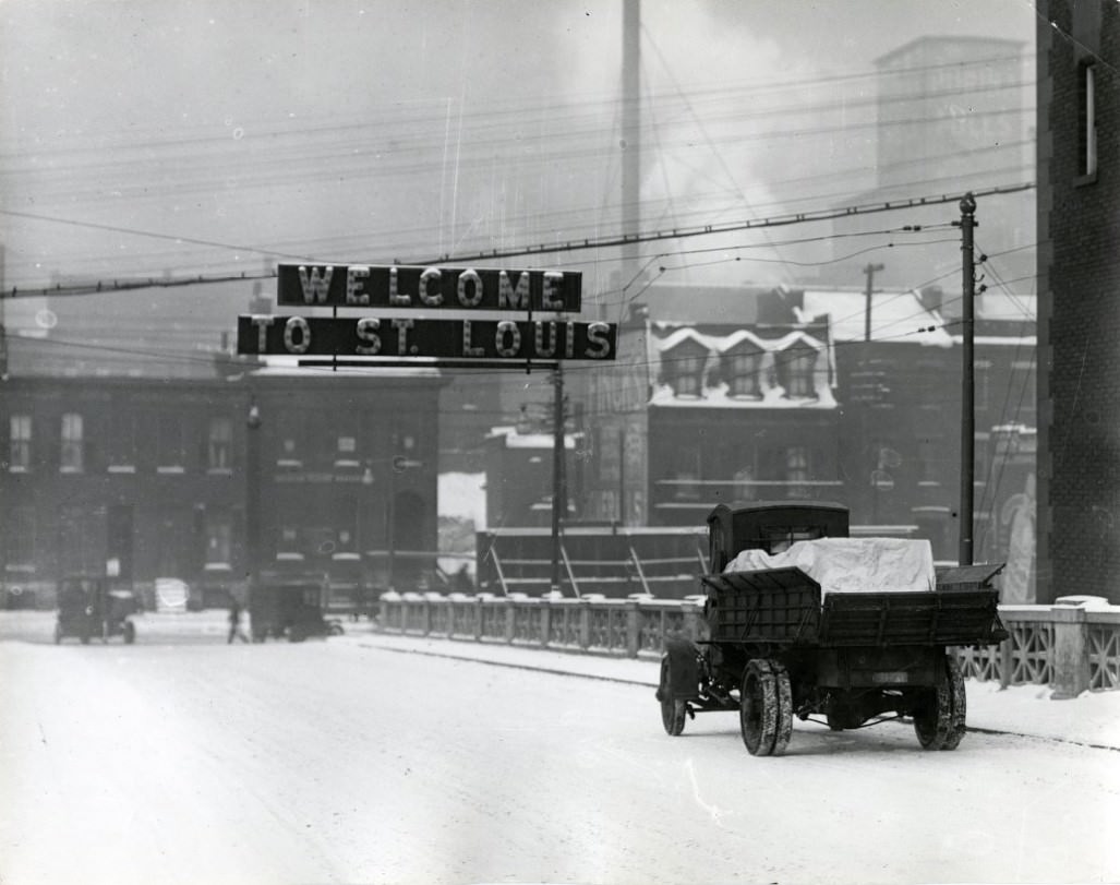 A truck driving in the snow across the Free Bridge (now the MacArthur Bridge), into the city from Illinois. Exit is about 6th Street, 1910