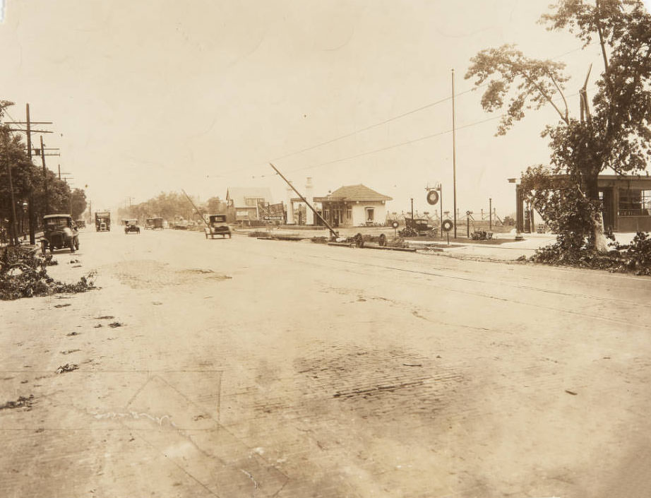 South Grand near its intersection with Meramec St. Gas stations for Tower Oil Co. and Shell Oil can be seen.