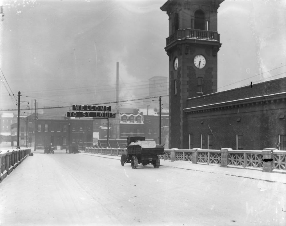 Welcome to St. Louis, 1910. This photograph shows of a truck driving in the snow across the Free Bridge (now the MacArthur Bridge), into the city from Illinois.