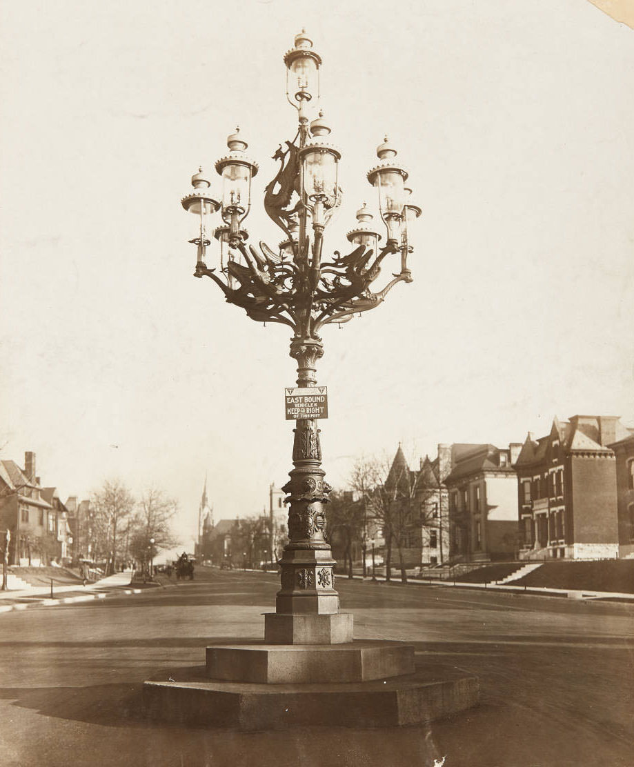 An ornate lamppost at the intersection of Lindell and McPherson near the St. Louis University campus, looking east, 1915