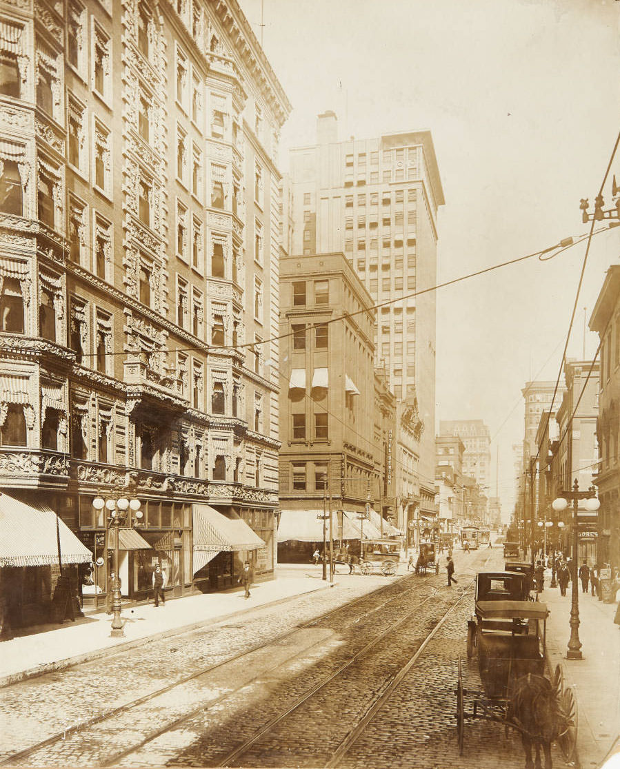 A busy downtown traffic scene near the intersection of 9th and Pine streets, looking east on Pine, 1915