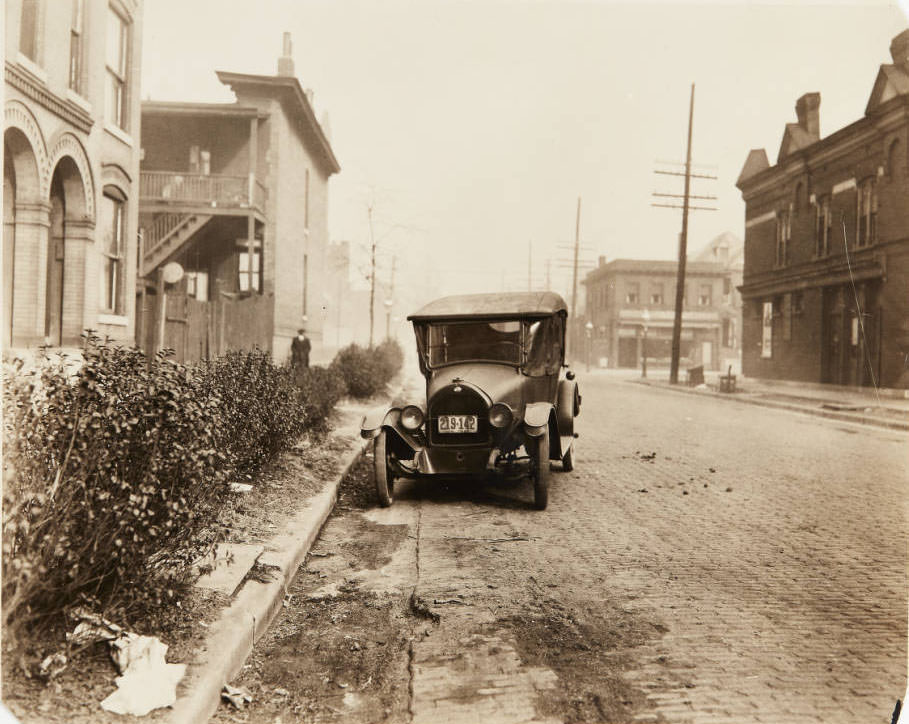 A car parked on the street on Pendleton Avenue near its intersection with Page Blvd, 1915