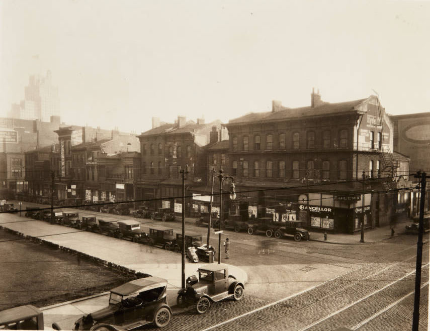 A row of buildings along the south side of Olive Street, between 13th and 14th streets.