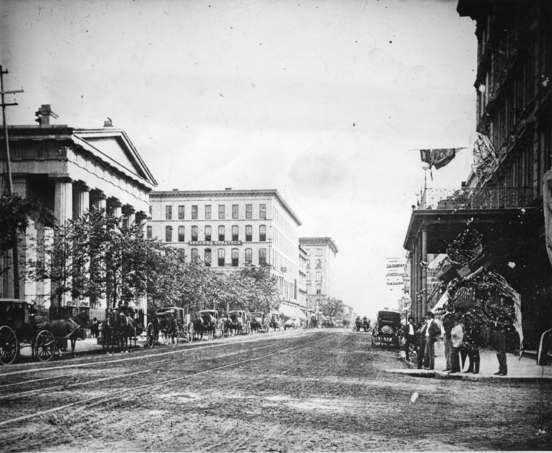 Broadway looking south from Chestnut. Showing court house, Bryant and Stratton Business College and Southern Hotel on left side of plate, 1870s
