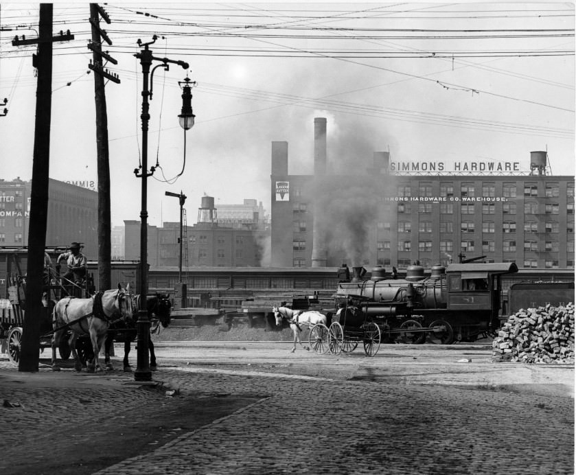 Locomotive in front of Simmons Hardware, 1890