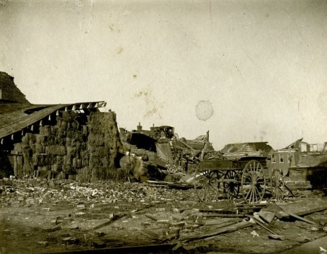 The debris and structural damage of a barn, building, and wagon caused by a tornado on May 27,1896 in St. Louis, Missouri,