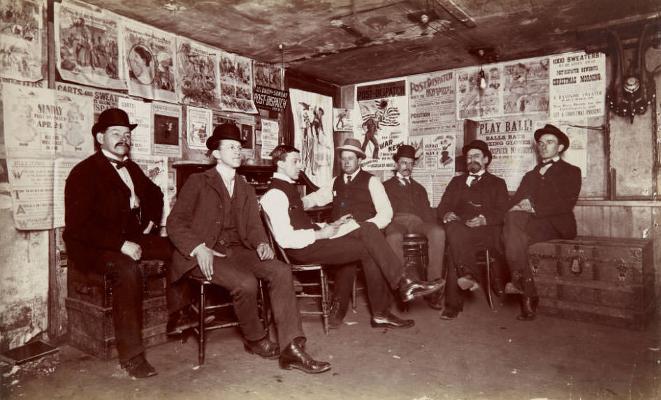 Seven seated men who comprised the circulation department at the Post-Dispatch, 1899