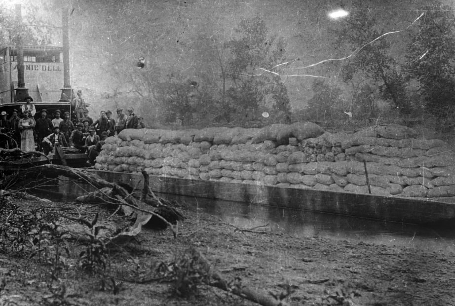 Annie Dell with tow and cargo. Crew posing on the bow. Gasconade River, carrying wheat, 1890.