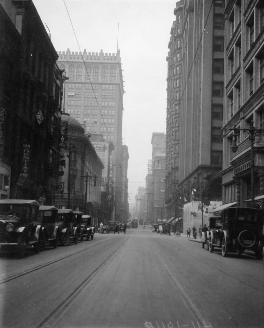 Looking west on Olive Street from just east of the intersection at North 7th Street downtown. 618 Olive Street shows a sign for a dentist office, 1925