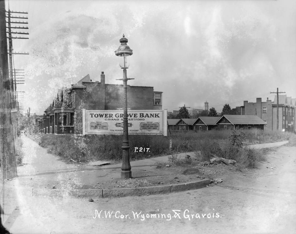 View of the southwest corner of Gravois and Wyoming in the Tower Grove East neighborhood. St. Pius V Catholic Church is visible in the distance, 1925