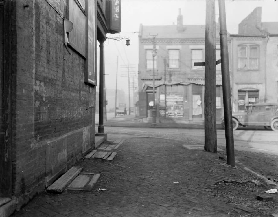 View of storefronts on Biddle Street, possibly at the intersection of Biddle and 15th Street, 1925