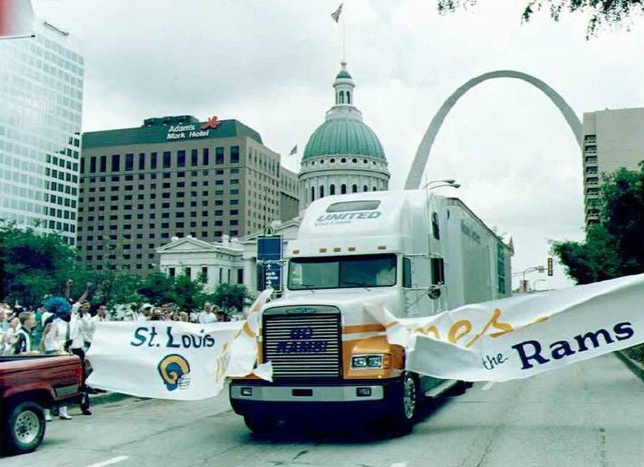 A moving van, part of a convoy of trucks carrying,