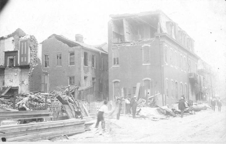 Cleanup is underway in this view of 8th Street, in the Soulard neighborhood.