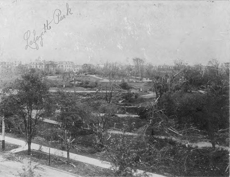 The tornado did some of its worst damage in this neighborhood, destroying nearly all the trees in the park. Damaged houses on the surrounding streets of Lafayette Square can be seen in the distance.