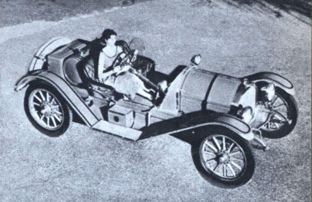 1914 Overland speedster; only 50 were built. Note monocle windshield protecting driver.