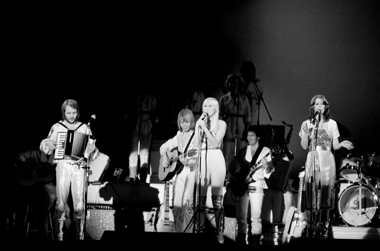 Benny Andersson, Bjorn Ulvaeus, Agnetha Faltskog and Anni-Frid Lyngstad performing on stage at the Brondbyhallen on January 31,1977 in Copenhagen, Denmark