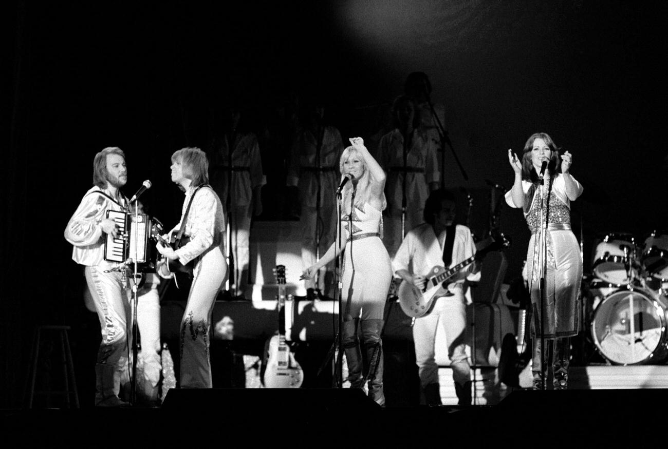Benny Andersson, Bjorn Ulvaeus, Agnetha Faltskog and Anni-Frid Lyngstad on stage at the Brondbyhallen on January 31,1977 in Copenhagen, Denmark.