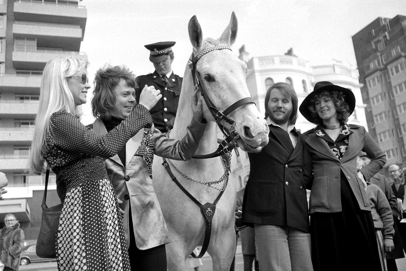 Swedish pop group Abba meet a mounted policeman as they relax in Brighton, after their victory in the Eurovision Song Contest.