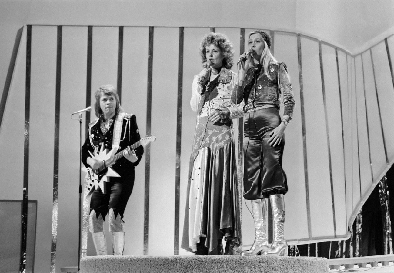 Bjorn Ulvaeus, Anni-Frid Lyngstad and Agnetha Faltskog of ABBA playing live on stage, 1974