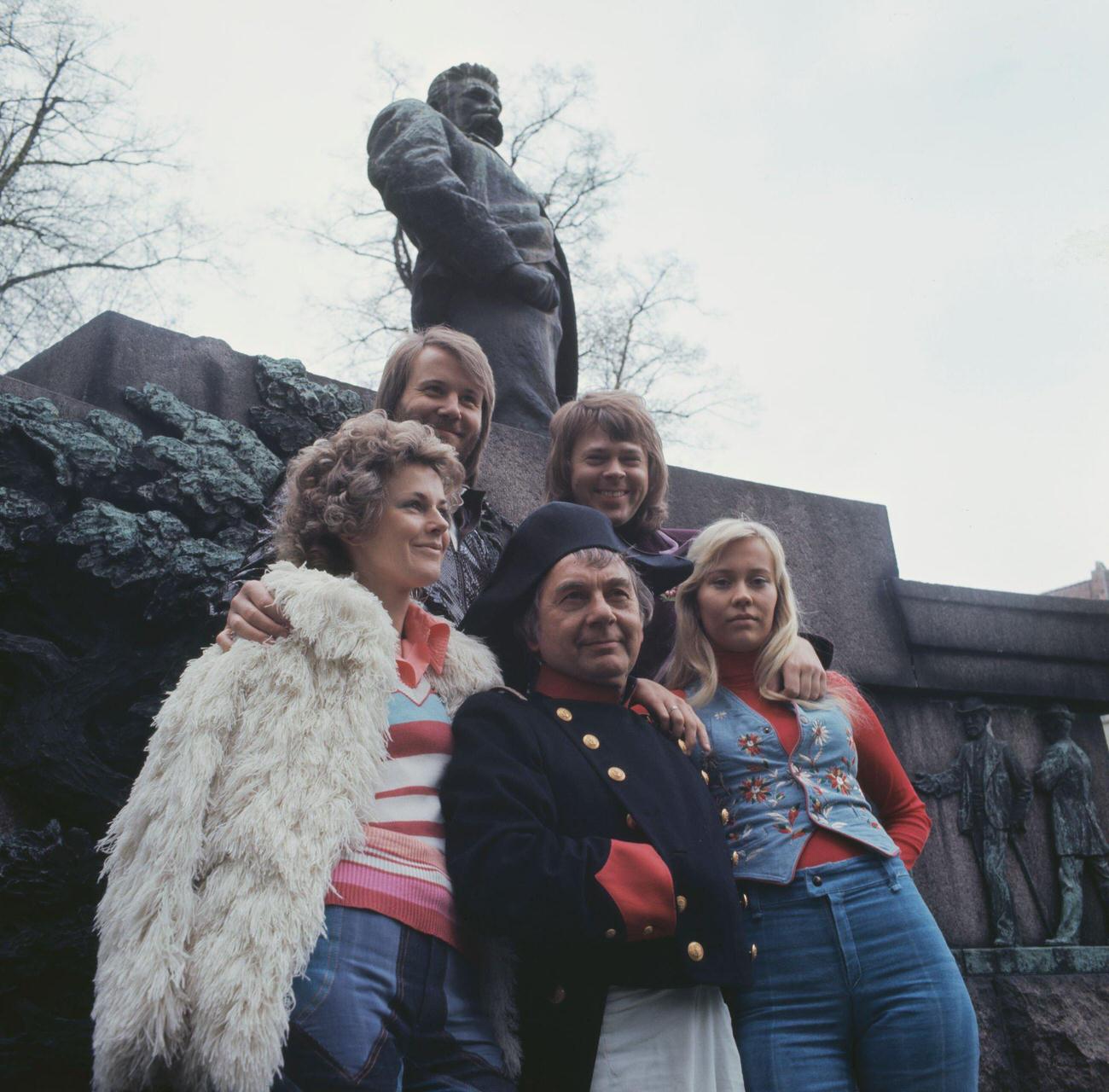 An actor dressed as Napoleon Bonaparte poses with Swedish pop group Abba to promote their single 'Waterloo' in Copenhagen, Denmark in 1974.