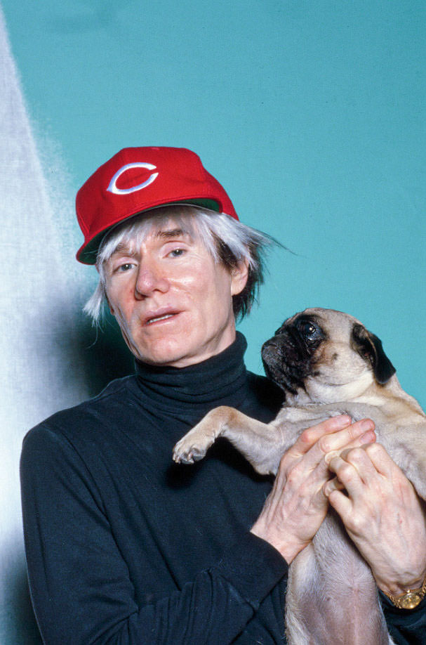 Andy Warhol with Brigid Berlin's Pug at the Factory, 1985