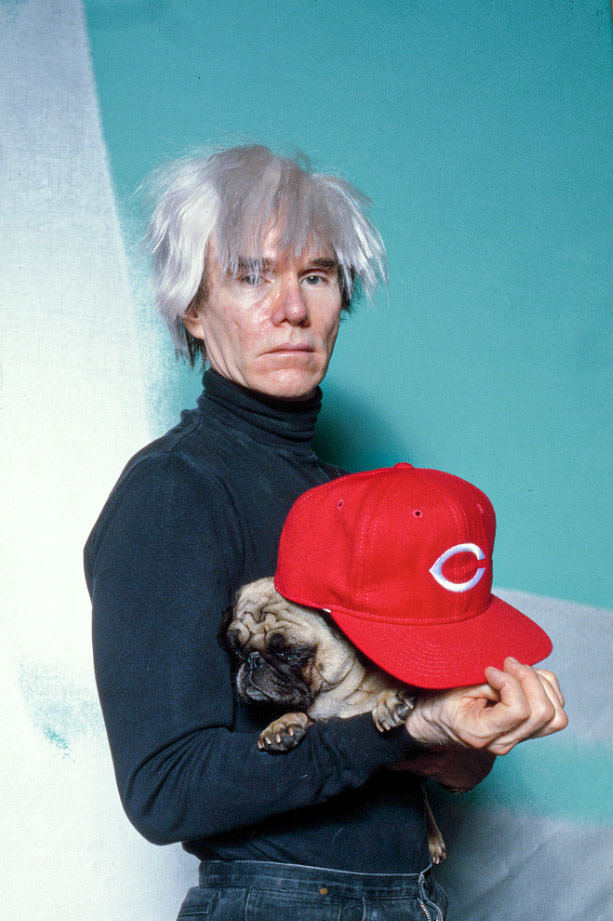 Andy Warhol with Brigid Berlin's Pug at the Factory, 1985